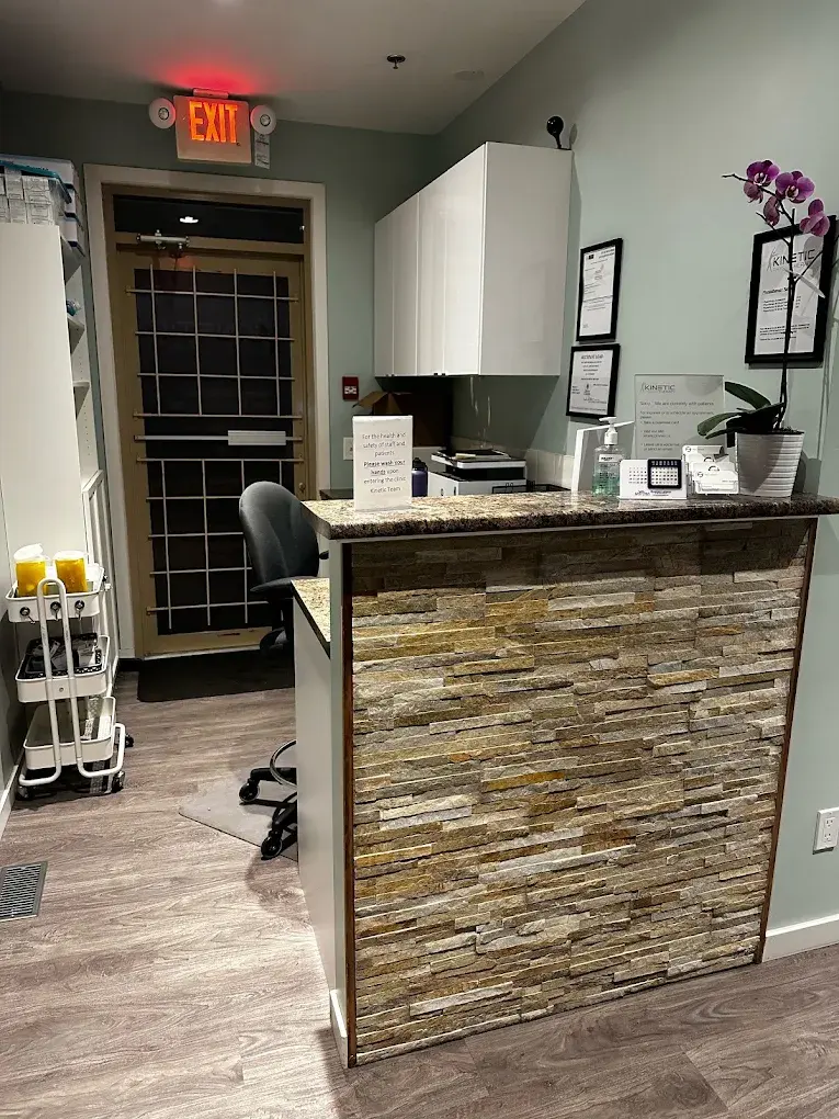 The reception desk and waiting area at Kinetic Therapy Clinic